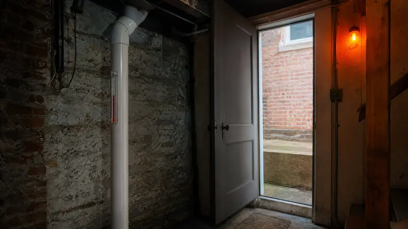 Ground-floor apartment entrance in an older brick building